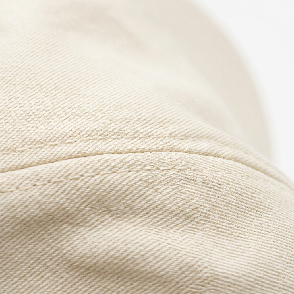 Cream cotton twill fabric texture macro detail pearl cap