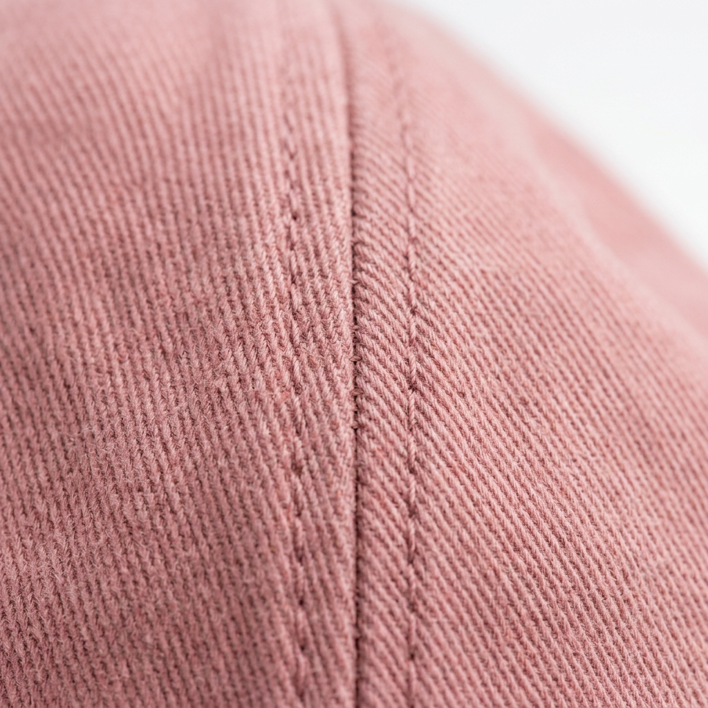Cotton twill fabric texture macro detail dusty rose women's cap